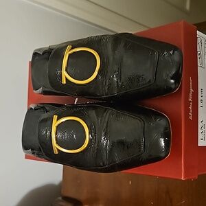 Ferragamo black flat shoes with Gold buckle, size 10